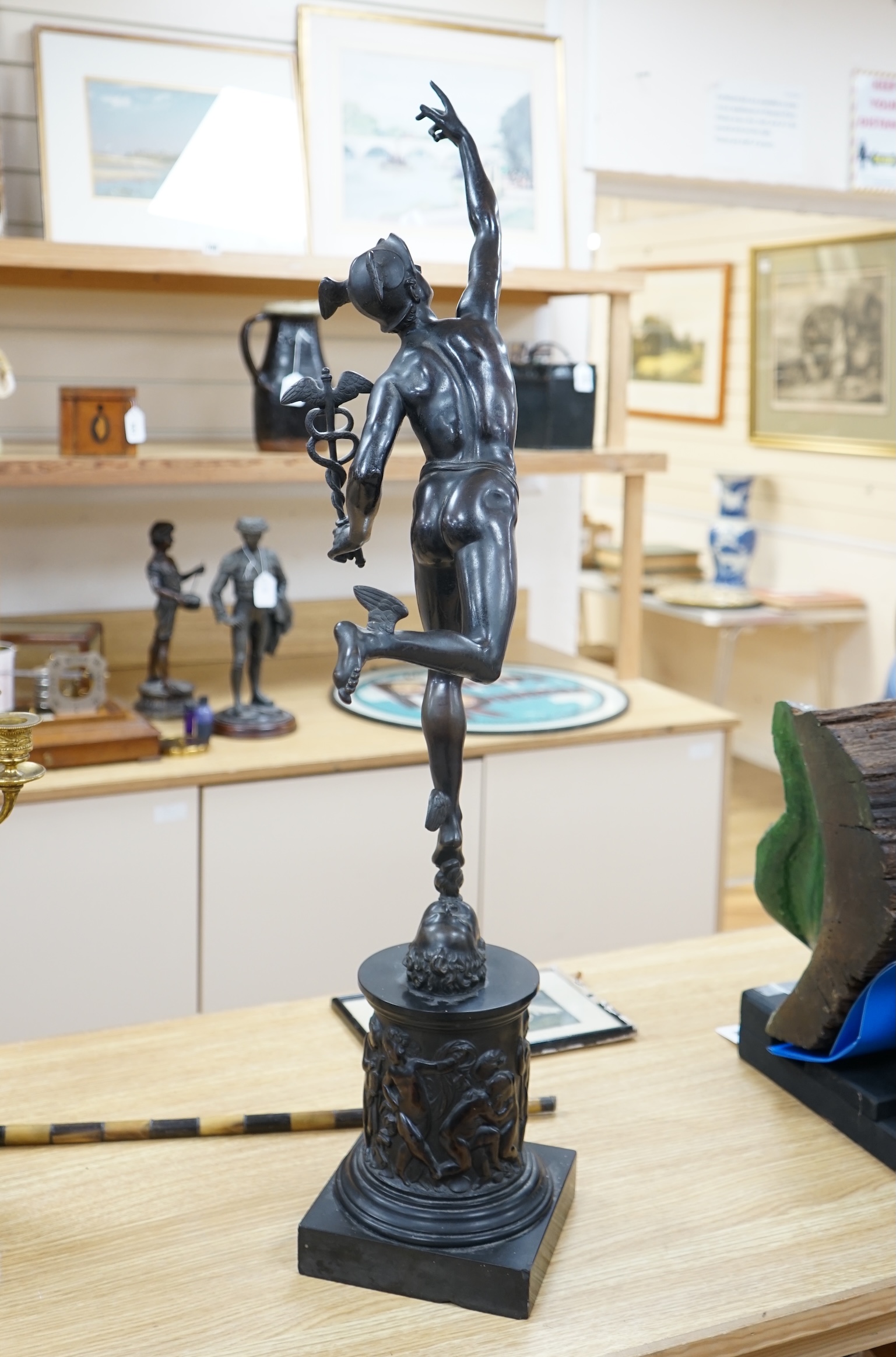 A late 19th / early 20th century Grand Tour style bronze study of Mercury raised on a circular column base, 87cm high. Condition - small chips to black slate plinth otherwise in good condition